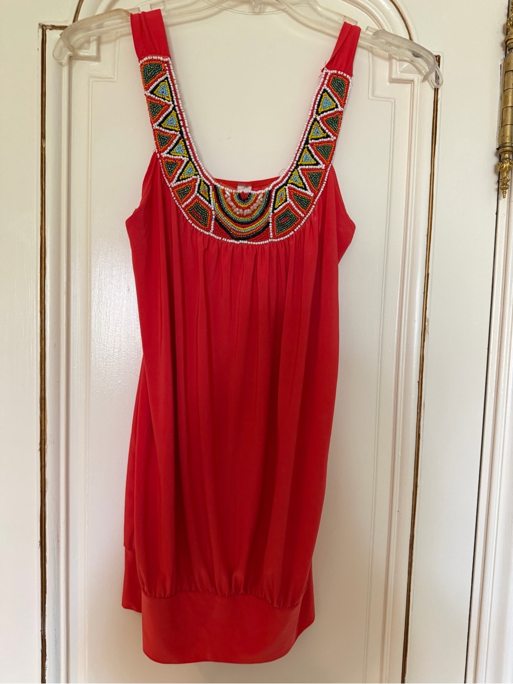 Red beaded top/blouse with geometric patterned neckline in size Small